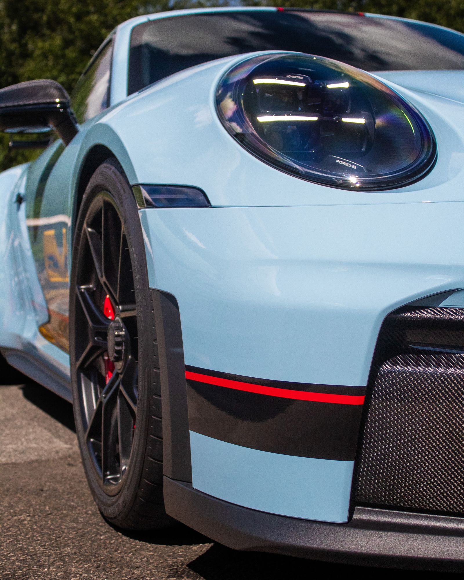 Light blue Porsche 911 GT3, front wheel detail