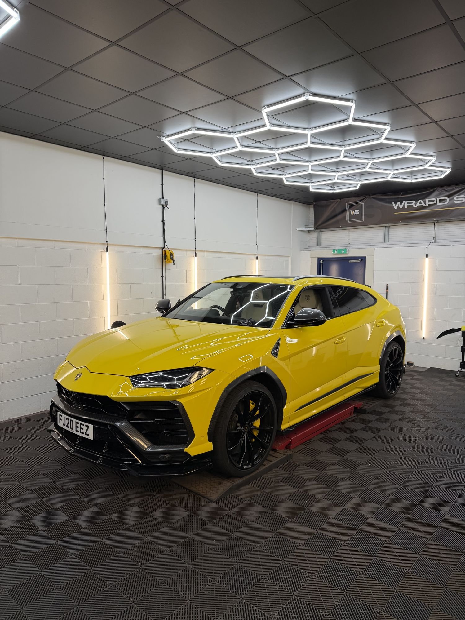 Yellow Lamborghini Urus in the studio
