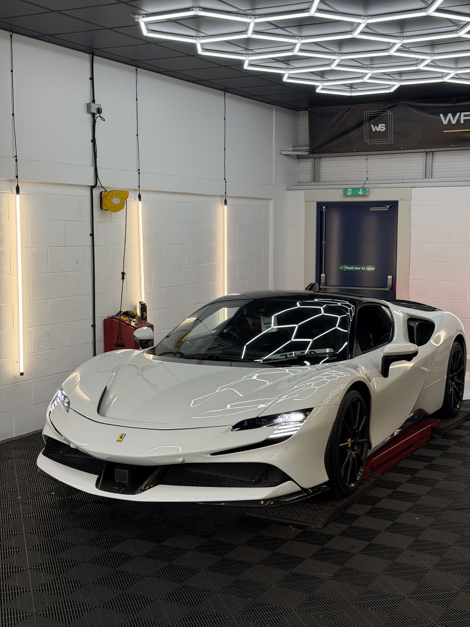 White Ferrari SF90 in the studio