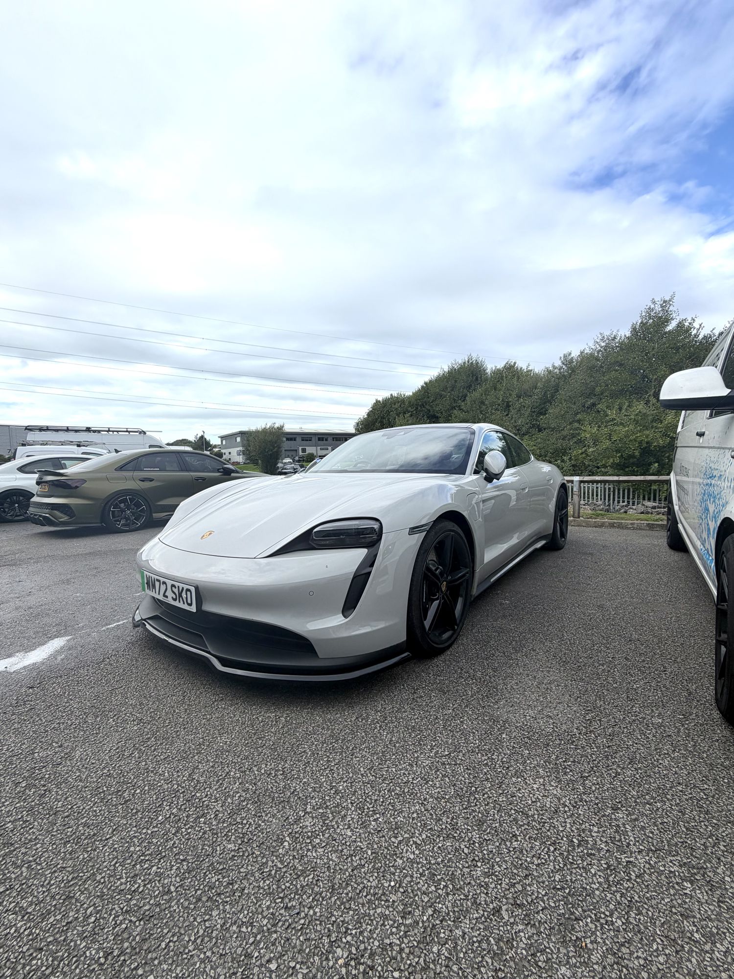 White Porsche Taycan outdoors
