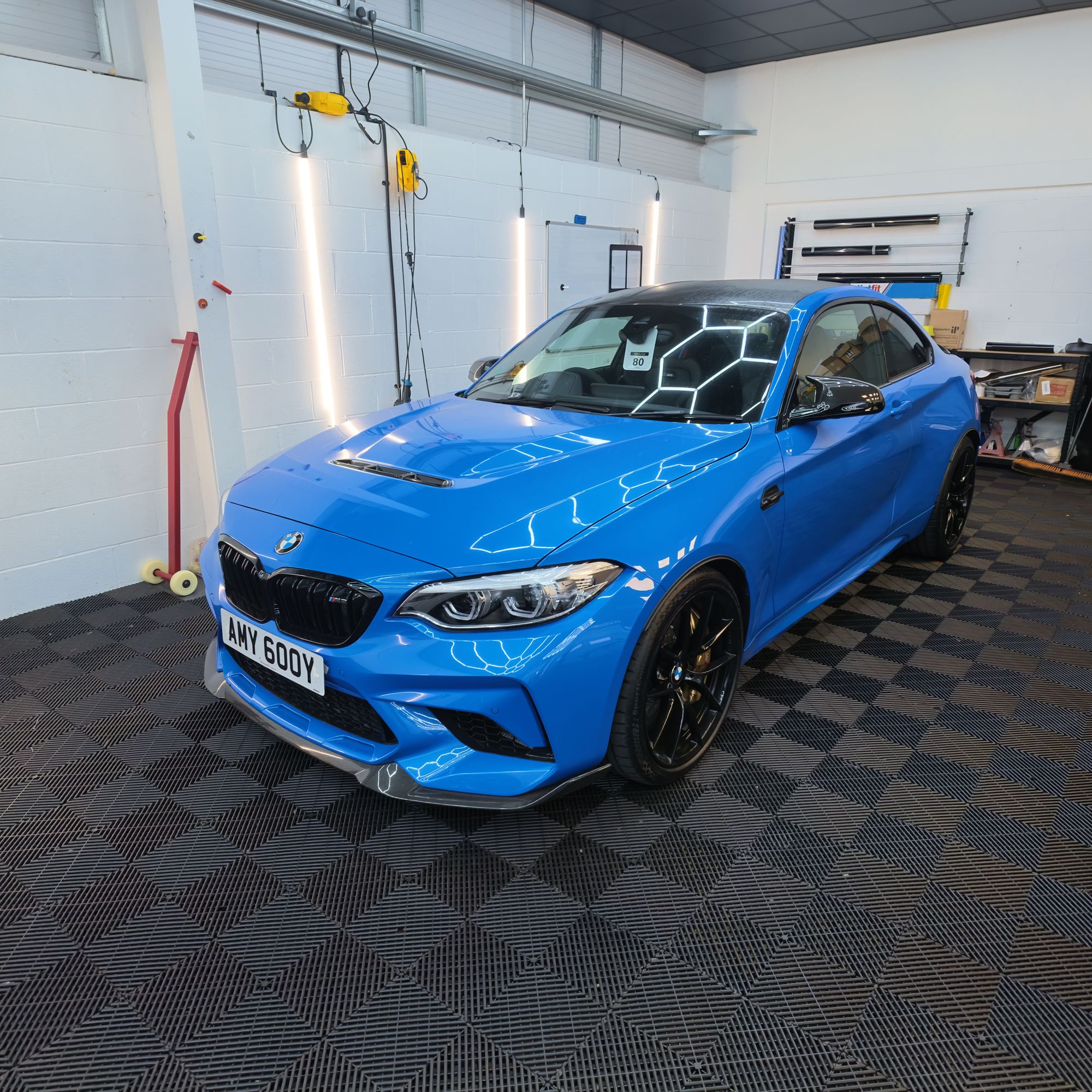 Blue BMW M2, front three-quarter