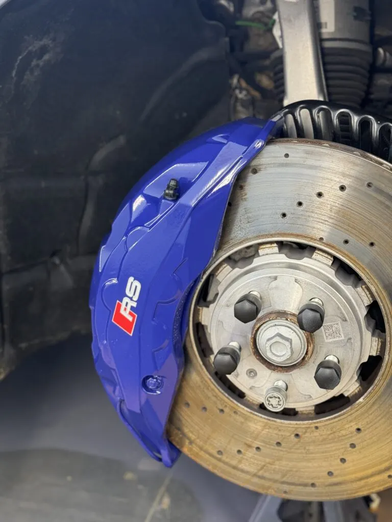 Blue Audi RS brake caliper and drilled disc