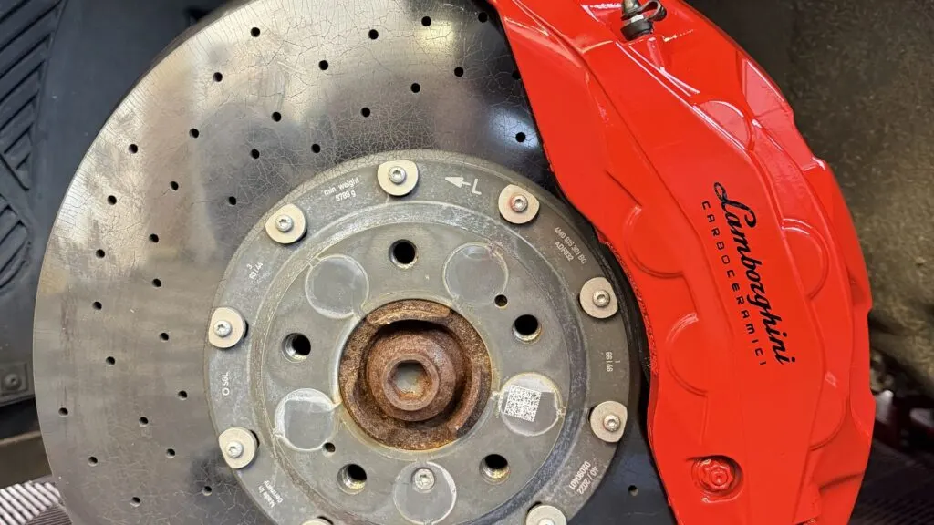 Red painted brake caliper with Lamborghini script, caliper painting at Wrapd Studios