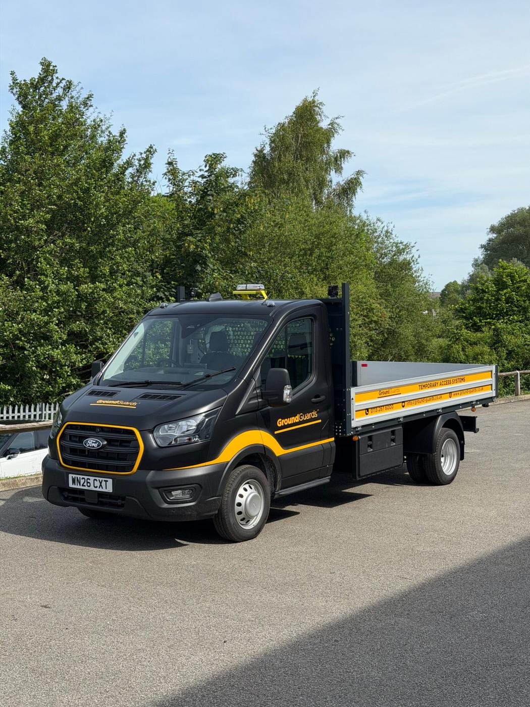Ground Guards Ford Transit tipper in black and yellow fleet livery by Wrapd Studios