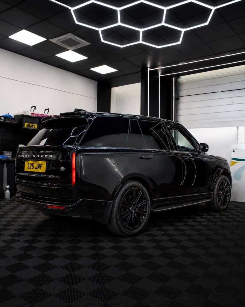 Black Range Rover L460 with Urban Automotive body kit, rear three-quarter view in the Wrapd Studios workshop in Knaresborough